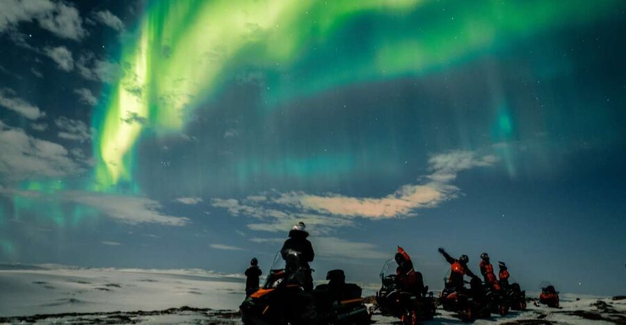 From Alta: Northern Lights Night Adventure By Snowmobile - Learning to drive a snowmobile in convoy