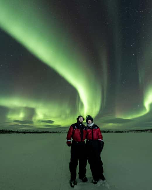 Kilpisjärvi: Northern Lights Snowmobile Tour with Photos - Riding from Kilpisjärvi into the dark