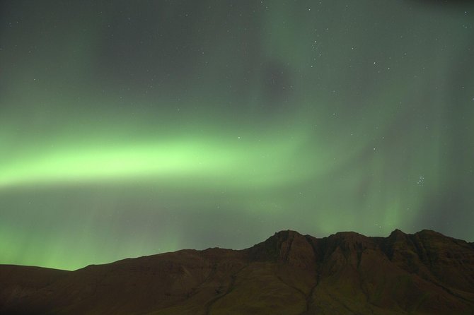 Northern Lights Cruise from Downtown Reykjavik - Outdoor decks, heated cabin, and winter clothing