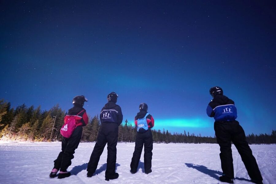 Rovaniemi: Northern Lights Sleigh Ride - Riding behind the snowmobile