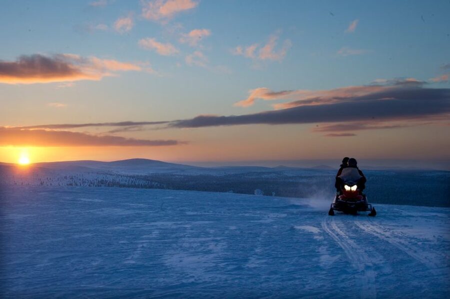 Rovaniemi: Northern Lights Snowmobile Tour - Pickup, meeting point, and a small sustainability change
