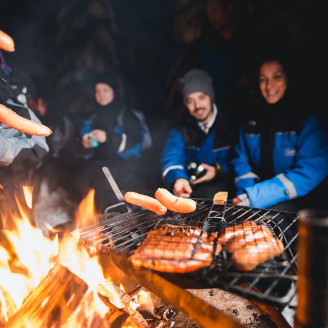 Rovaniemi: Search for Northern Lights Snowmobiling Trip - Warm clothing that makes the price easier to judge