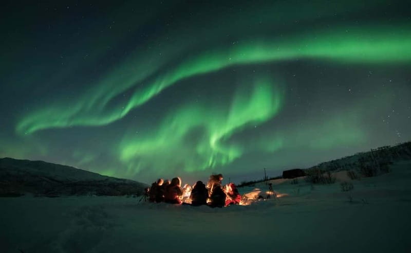 Tromsø: All inclusive Aurora Hunt with photos, food & drinks - Thermal suits, boots, and the first campfire