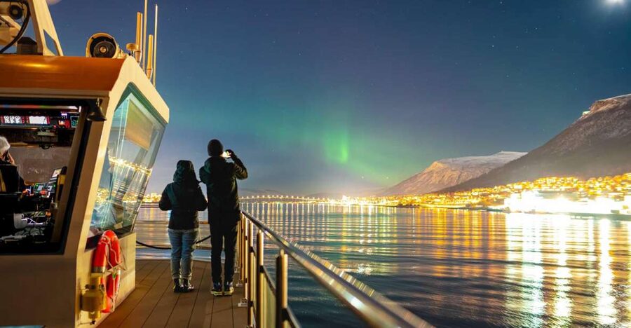 Tromsø: Electric Northern Lights Cruise - Tromsø by night on the return